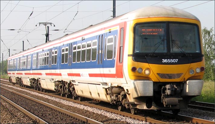 Class 365507 on a down train at Conington in 2006 