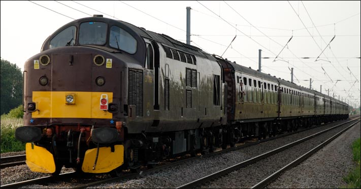 West Coast Trains class 37 706 at the rear of The White Rose at Conington 