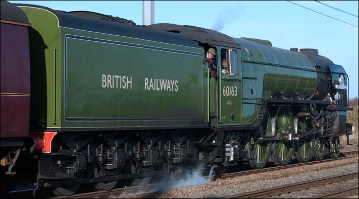  Tornado with full British Railways on its tender is in its early green colours at Conington on the same day