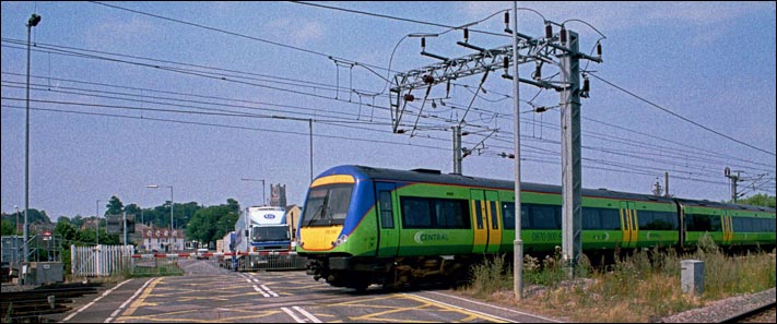 Central Trains Class 170 on the level crossing at Ely