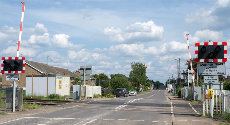 Two of the three level crossing at Queen Adelaide at Ely in 2020 
