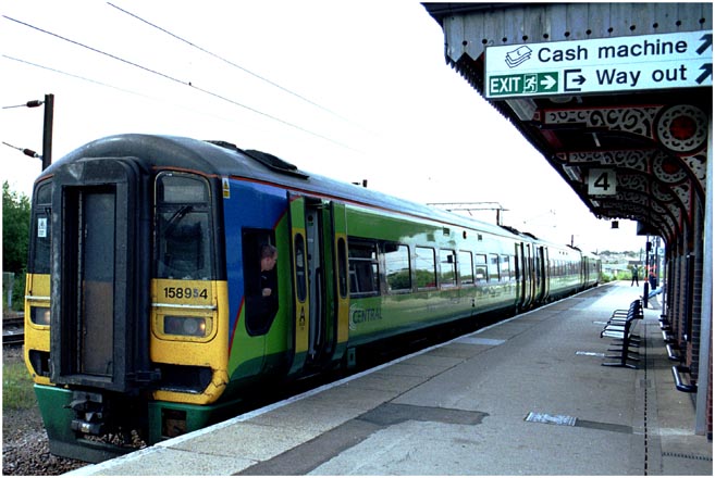Class 158954 in platform 4 at Grantham in 2004