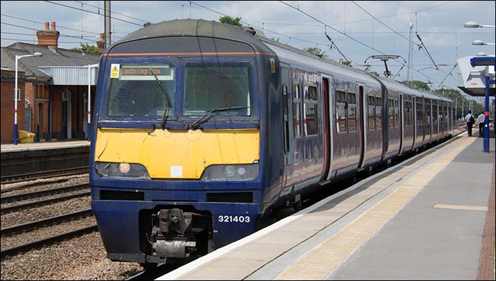 First Capital Connect train to Kings Cross in Hitchin station with class 321403 