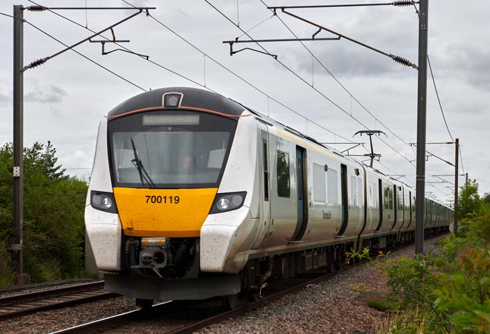 Thameslink class 700119 at Holme level crossing on the 21st August in 2021