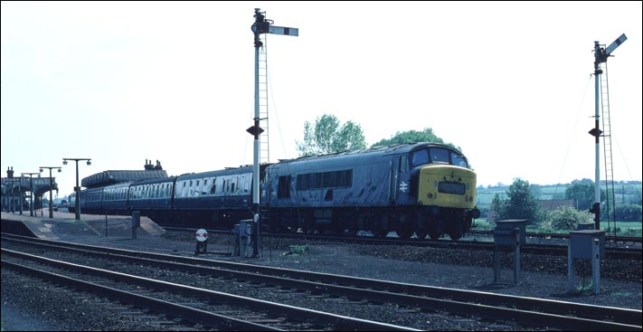 Class 45122 leaves Kettering station on a down train. Class 45122 leaves Kettering station on a down train.