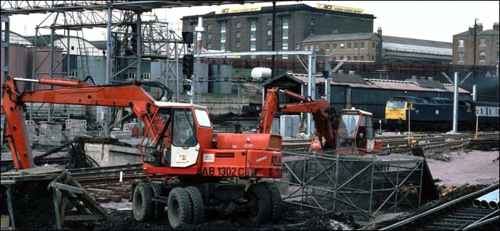 A class 47 comes into Kings Cross as diggers work on the new layout. A class 47 comes into Kings Cross as diggers work on the new layout