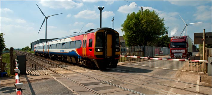 East Midland Trains class 158846 over the Funthams Lane crossing in 2010