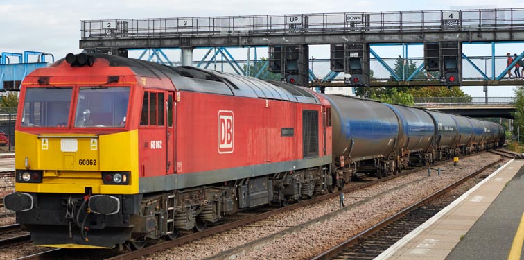 DB class 60064 named 'Stainless Poineer ' in DB red with full tank wagons at Lincoln station 