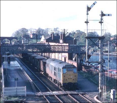 A class 31 in Melton Mowbray with a train of hoppers. A class 31 though Melton Mowbray station