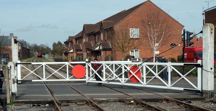 crossing gates at the north end of Derham station