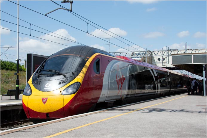 Virgin class 390 104 Pendolino in Milton Keynes Central station on an up train on the 22nd of July  2014
