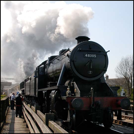  8F 48305 and class 5 out of Wansford on 28th April 2007.