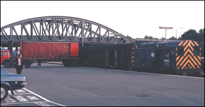 Class O8 406 with some parcels vans in platform 1 at Peterborough station