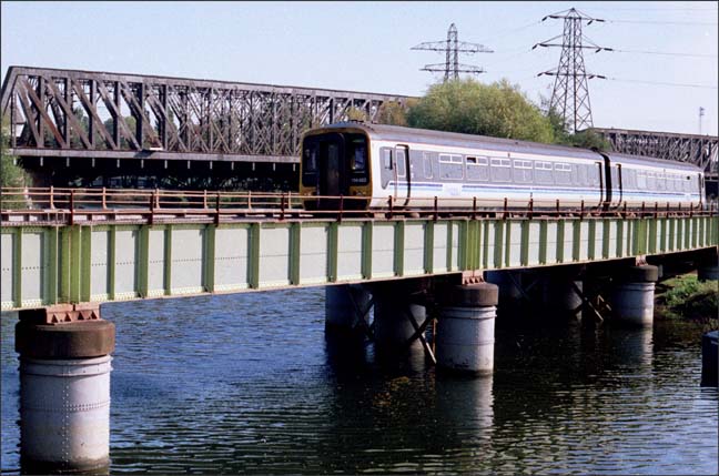 Central Trains 156222 over the River Nene still in the blue and grey colours of region railways