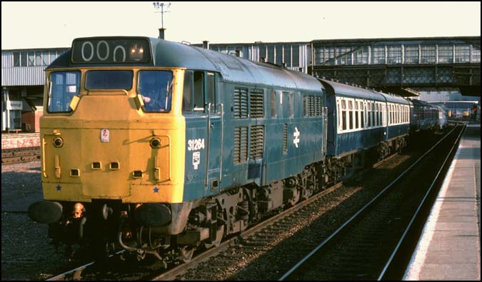 Class 31264 in platform 3 at Peterborough on a stopping train to London Kings Cross station. 