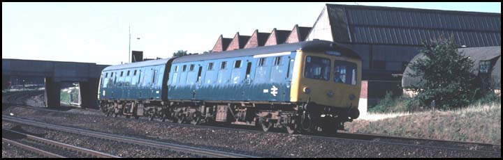  Cravens DMU on up fast with Peacock bridge in the background.