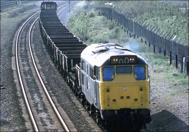  class 31 on the Stamford line with a freight of open wagons