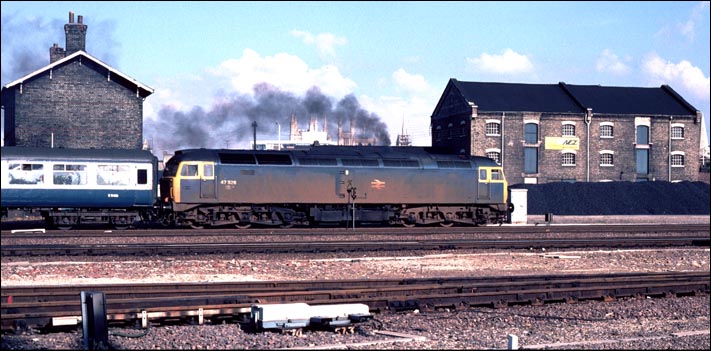 A rather dirty class 47 526 leaves Peterborough station 