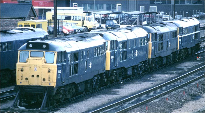 Four class 31s at Peterborough Depot 31192  31198  31125 3 1403  plus one on the next line.