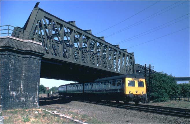  DMU in BR days coming under the ECML on the Peterborough March line