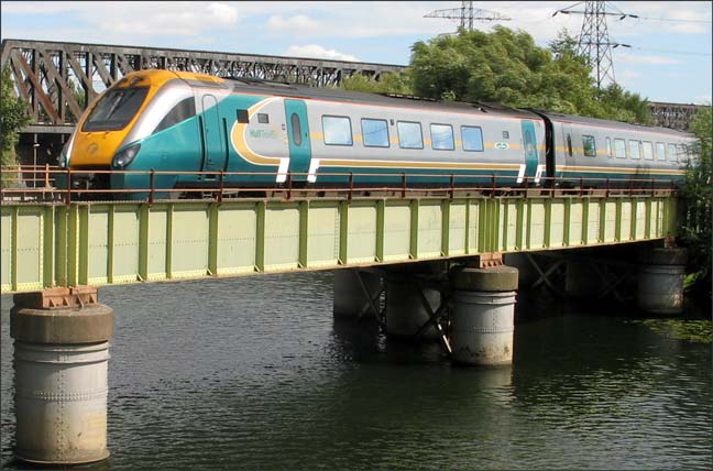 Hull Trains 222 on a Saturday in 2005 using the Peterborough March line over the river Nene railway bridge.