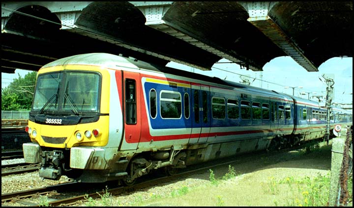 WAGN 365532 comes under Crescent Bridge out of platform 1 at Peterborough in 2004