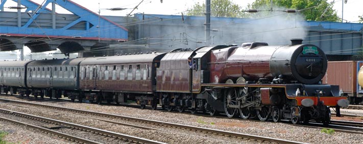 LMS Princess Class 4-6-2 number 46201 Princess Elizabeth comes under the Crecent road bridge and into platform 4 at Peterborough 