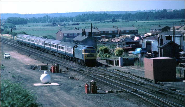 A class 47 on a down train at the site of Yaxley station 
