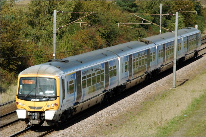 First Capital Connect 365519 EMU on the up fast at Crown Lakes