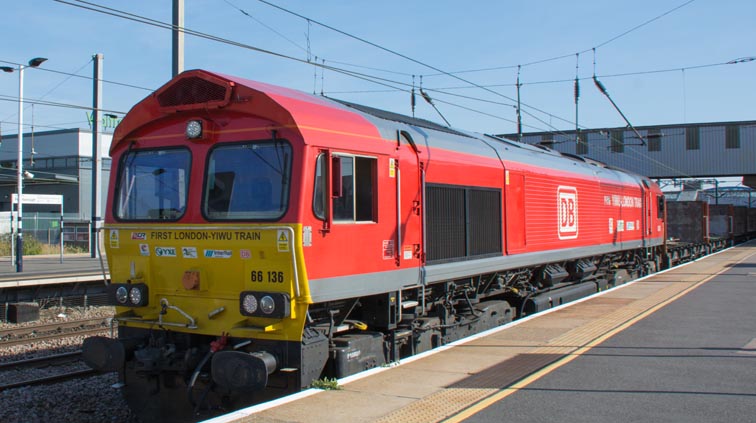 DB class 66136 in DB red with 'First London YIWU Train' on it in platform 4 