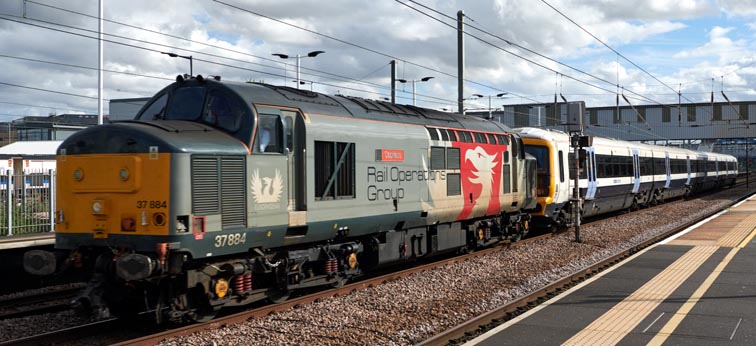 Rail Orerations Group class 37884 Cepheus  with drag on the down fast at Peterborough station with South Eastern class 46547 on the 4th October in 2021