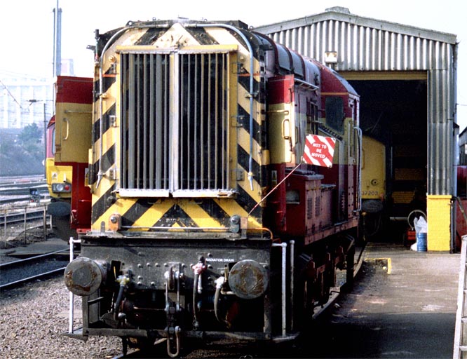 A class 08 next to the small shed at the Depot 