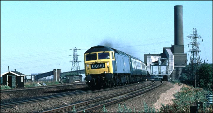 Class 47 on a up train with the now closed and removed Peterborough power station behind