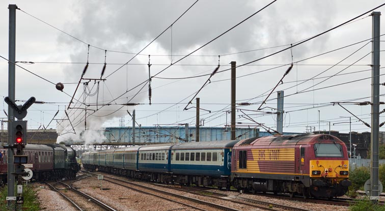 A3 60163 Flying Scotsman head north out of  platform 5 and  Class 67002 and class 67007 