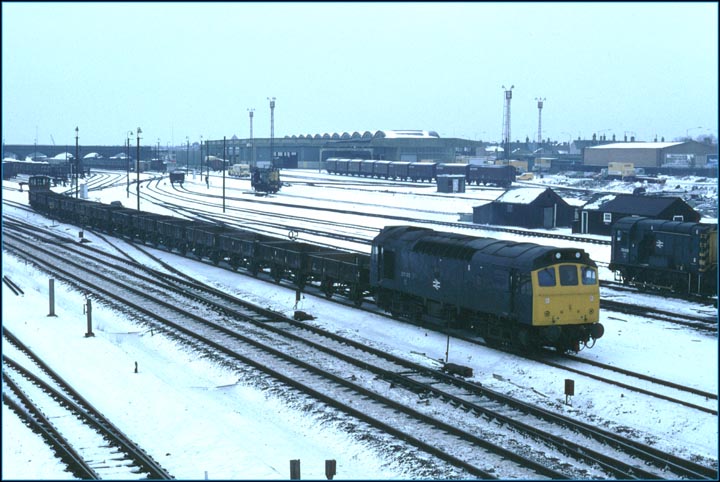 A Class 25 comes out of Westwood Yard with a freight on a cold winters day