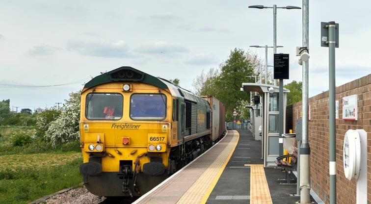 Freightliner class 66517 with train to Felixstowe at Soham Station 6th May 2022.