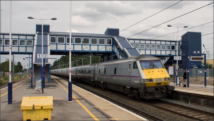 St Neots railway station with a East Coast train on the up fast in 2014 