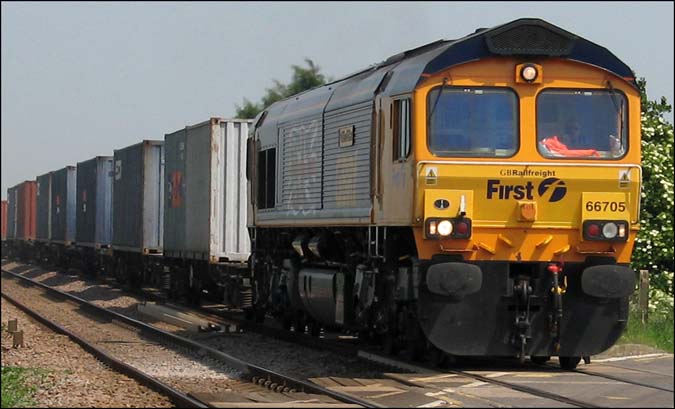First GBRf 66705 heading for Peterborough in June 2006 near Turves 