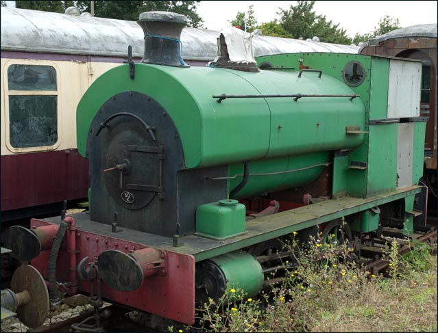 A green 0-4-0ST is awaiting its turn for an overhaul at Castle Hedingham