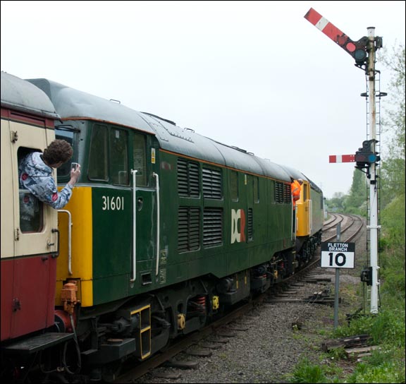 Class 31601 and 56312  head for Peterborough (NVR) station at Orton Mere May 2012