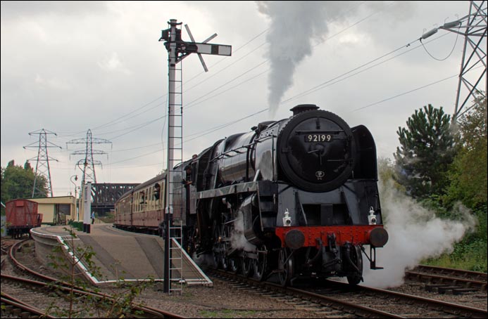 British Railways 9F 2-10-0 92199 about to leave the Peterborough Nene Valley railway station with a train to Wansford. British Railways 9F 2-10-0 92199 about to leave the Peterborough Nene Valley railway station with a train to Wansford.