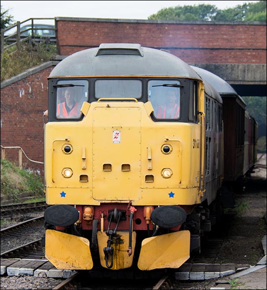 Class 31108 comes under the A1 road bridge and into Wansford on a train from Yarwell Class 31108 comes under the A1 road bridge and into Wansford on a train from Yarwell