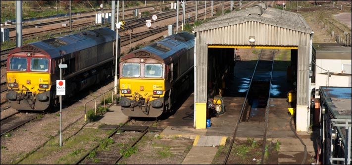 Class 66126 and class 66230 next to an empty shed at the Peterborough Depot on the 13th of November 2010