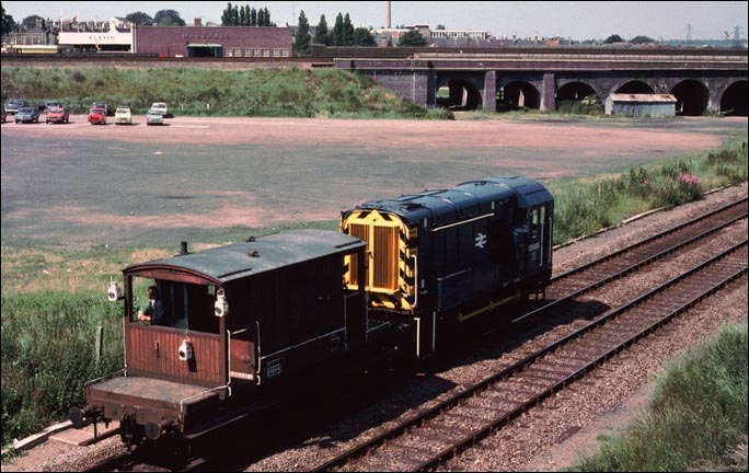 Class 08406 heads back to Peterborough depot after shunting at the PW depot near the football ground 