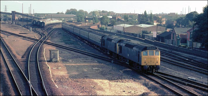 A pair of class 25s come from the bridge over the river Nene past what is now Great Notherns EMU sidings 