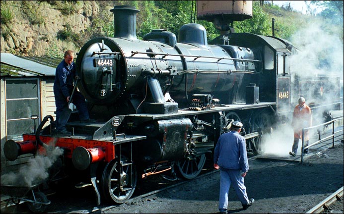 46443 is in 2006 having its ash dug out from the smoke box and the ash cleaned out from the ash pan under the fire at Bewdley loco