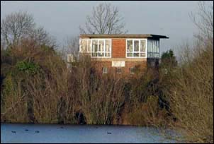 Sleaford South signal box from across a lake in November 2004 