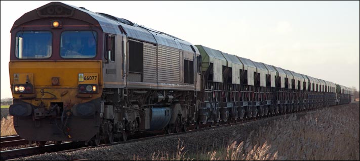 DB class 66077 at Turves heading for March on the 13th of January 2014