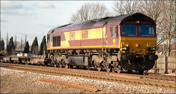 DB Schenker Rail class 66011 about to cross the Ramsey road crossing at Whittlesea 