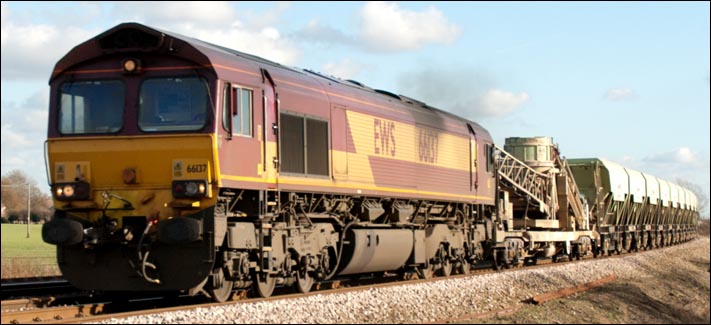 DB Schenker Rail class 66137 about to cross the Ramsey road crossing at Whittlesea 